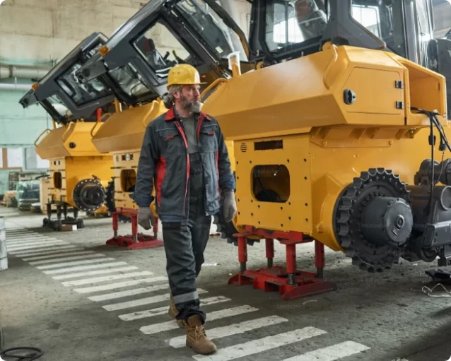 A machine specialist near large machinery that require new parts designed by DMi