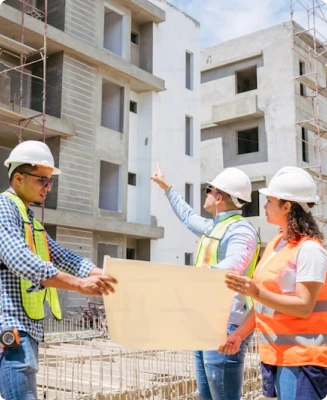 Contractors discussing a plan for building, representative of the construction industry